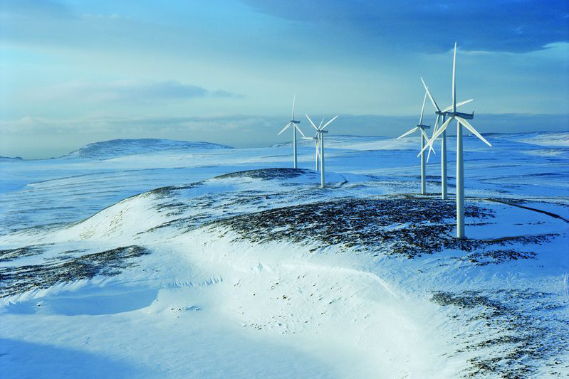 Wind park on top of a snowy mountain