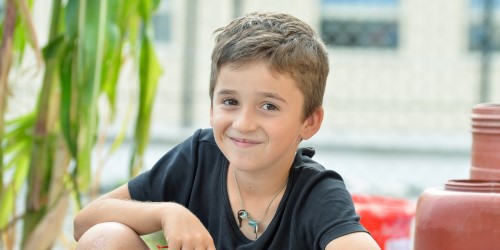 Boy sitting and smiling