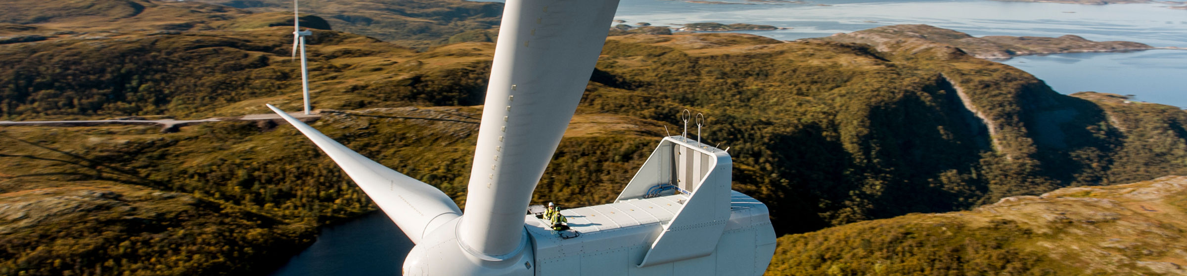 Wind turbine in coastal landscape